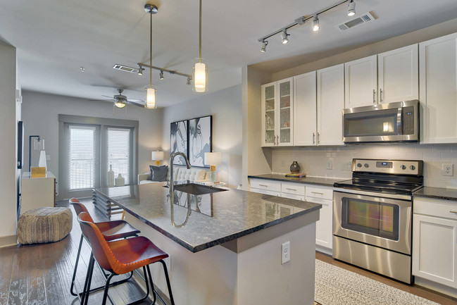 Kitchens feature granite countertops and custom maple cabinetry - Windsor Old Fourth Ward