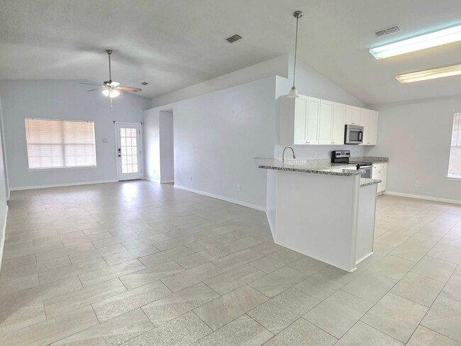 Building Photo - Charming 4BR/2BA Brick Home with Solar Panels