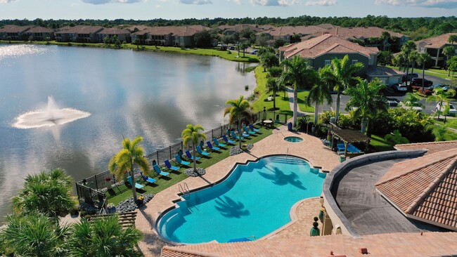 Experience our enchanting pool by the lake. This oasis can be yours! - Lakes of Tuscana