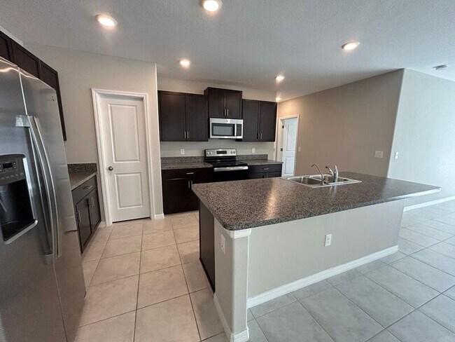 Foto del edificio - 7329 Canterbury Bells Ct