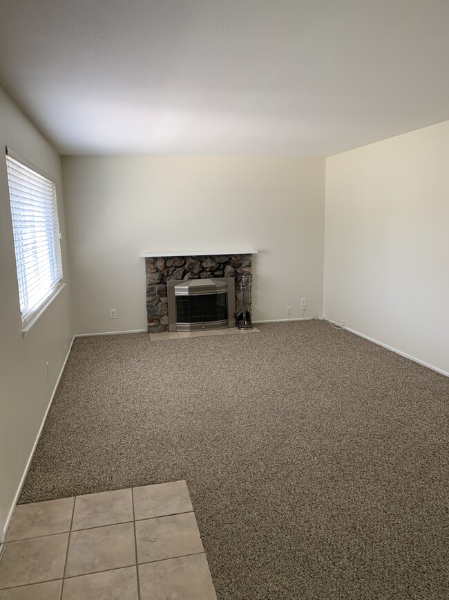 Living Room with Fireplace - 6447 Bollinger Rd