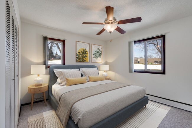 Welcome to St. Anthony Group, where modern comfort meets stylish design. This cozy bedroom features ample natural light, a ceiling fan for your comfort, and a serene atmosphere. Don’t miss your chance to call this home—contact us today! - Diamond Eight Terrace