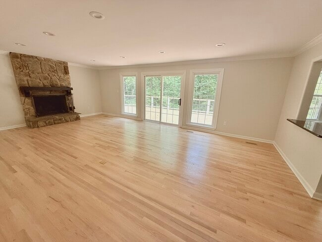 Bright and open main floor living area in center of home with large deck, off open kitchen and dini - 9248 Wood Glade Dr