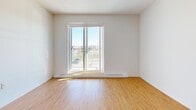 Located at 1900 Rue des Francs-Bourgeois in Boisbriand, QC, this well-appointed 2-bedroom, 2-bathroom unit offers a thoughtfully designed single-floor layout with a clean, modern aesthetic throughout. The open-concept kitchen and living area serves as the heart of the home, featuring light wood-tone cabinetry, quartz-style countertops, a central island with a stainless steel sink, and a full suite of stainless steel appliances including a range, refrigerator, and dishwasher. Light hardwood-style flooring runs throughout the main living areas and bedrooms, complementing the bright, neutral palette of white walls and trim. The primary bedroom is generously sized, benefiting from natural light through large windows with outdoor views, and is accompanied by a dedicated walk-in closet with wire shelving. The second bedroom is equally well-lit, also featuring a sizable window. Both bathrooms are finished to a high standard — the main bathroom includes a soaking tub, glass shower enclosure, and a modern vanity, while the second bathroom features a corner glass shower, light-toned tile flooring, and ample cabinetry. A dedicated in-unit laundry room houses a full-sized washer and dryer with overhead wire shelving for added storage convenience.