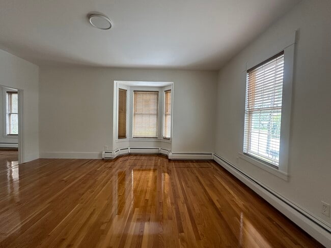 Spacious living room with abundant natural light - 7 Buxton Ct