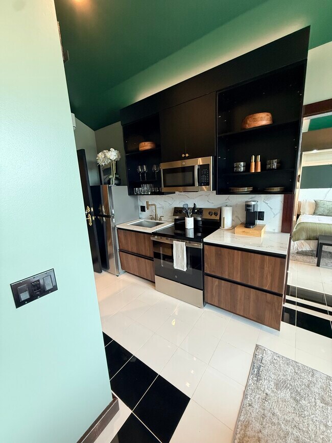 Cocina de la suite ejecutiva para estancias prolongadas - Villas on Turtle Creek
