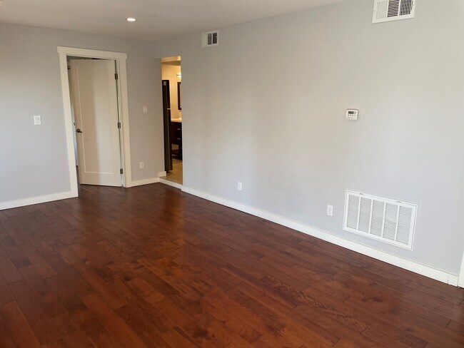 Living room, with bedroom door & entry to kitchen & bathroom - 707 Colusa Ave