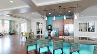 Located at 5721 Goodstone Dr in Raleigh, NC, this single-floor community space makes a striking first impression with its bold turquoise accent walls and coordinated décor. The open-concept layout connects a fully equipped kitchen to comfortable gathering and dining areas, creating a seamless flow throughout the space.

The kitchen is a standout feature, outfitted with stainless steel appliances including a full-size French door refrigerator, rich warm-toned wood cabinetry, dark granite countertops, and a built-in coffee station. Pendant lighting in sleek white tones hangs from a tray ceiling, casting warm light over the central island and counters.

Surrounding the kitchen island, vibrant woven bar-height chairs with turquoise cushions provide casual seating, reinforcing the space's energetic color theme. Dark hardwood flooring anchors the room and extends into an adjacent dining area furnished with additional seating under natural light from large windows.

Recessed lighting throughout, combined with the layered tray ceiling details, adds architectural interest and ensures the space is well-lit at all hours. A secondary lounge or meeting area is visible in the background, separated by glass-paned doors, offering a more private setting within the same cohesive design language. Overall, the space exudes a lively, welcoming ambiance ideal for social gatherings and community use.