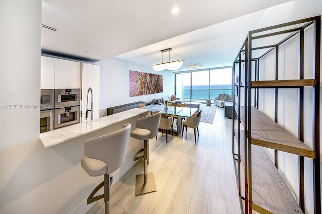Building Photo - 10203 Collins Ave