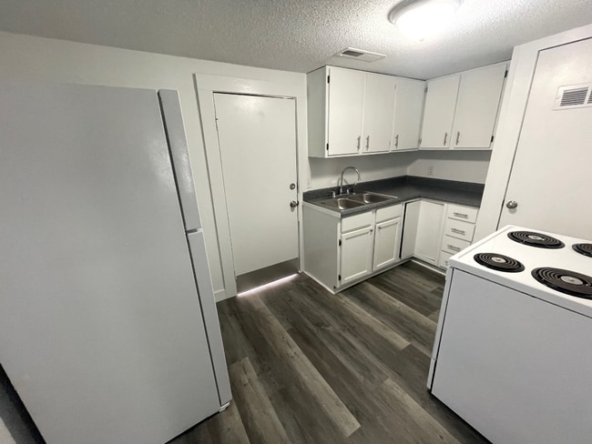 Building Photo - "Charming 2-Bedroom Wichita Home with Gleaming Hardwood Floors!"