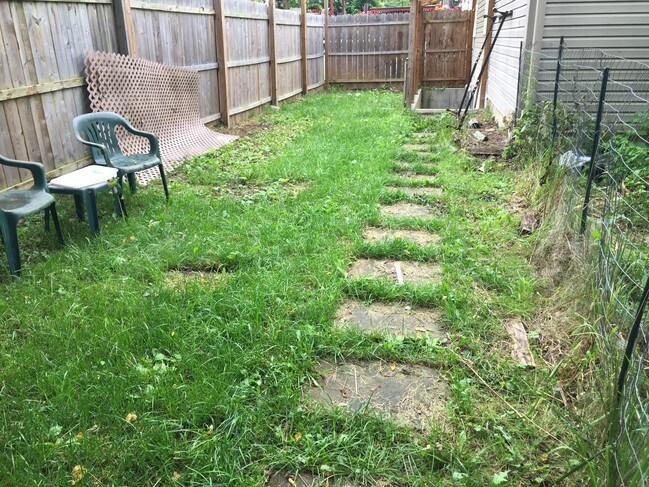 All fenced in steps to apartment - 141 Hoover St