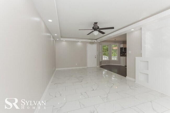 Building Photo - This spacious 4BR 2.5BA home features an o...