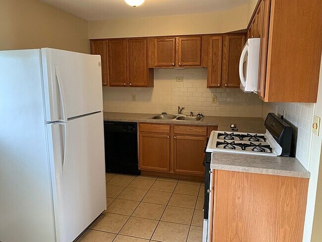 Kitchen in upper level - 1528 W Daytona Dr