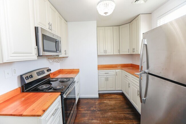 Building Photo - Stunning upstairs unit just one block from...