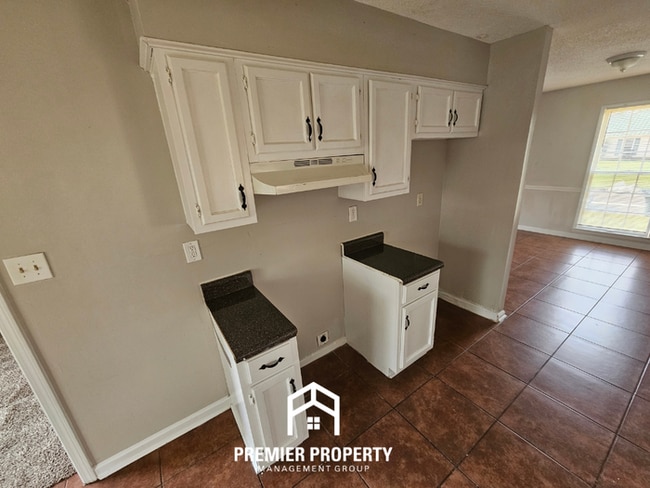 Building Photo - Quiet Cove Living in 38115 | 3BR/2BA with Brick Fireplace & Fenced Yard