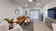 Located in Georgetown, Indiana, this single-story home offers a well-planned layout with 1 bedroom, 2 bathrooms, a dedicated office, and a laundry room, all finished with consistent, modern details throughout. Light neutral walls and light wood-tone luxury vinyl flooring create a cohesive, airy feel across every room.

The open-concept kitchen and living area serves as the heart of the home. The kitchen is outfitted with white shaker cabinetry, granite countertops, stainless steel appliances, and a central island with seating for multiple guests — ideal for both everyday meals and entertaining. Recessed lighting and a ceiling fan keep the adjacent living room bright and comfortable, while a sliding glass door invites natural light and outdoor access.

The primary bedroom features vaulted ceilings, a large window for natural light, a ceiling fan, and a direct en-suite bathroom connection, along with a dedicated closet. The bathrooms echo the kitchen's clean aesthetic with white cabinetry and granite surfaces.

A separate office with a window provides a quiet, functional workspace. The laundry room is a practical standout, offering full-size washer and dryer units and additional utility space. Hallways connect each area seamlessly, contributing to the home's efficient and comfortable flow.