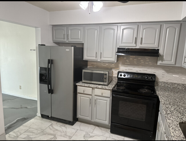 Kitchen: Granite countertops and new tiles - 9200 Edwards Way