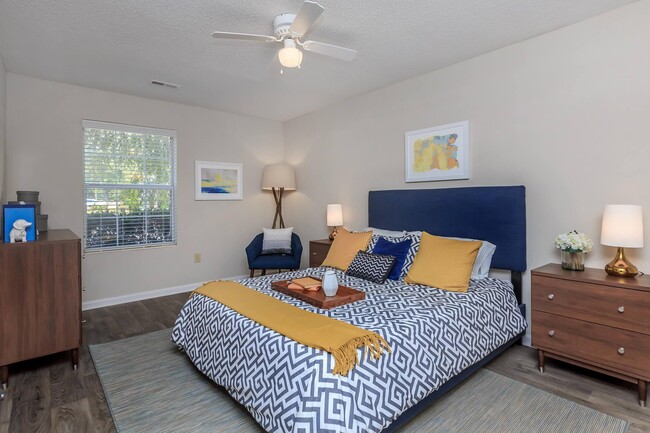 Master Bedroom with Natural Light- Gold Interior - Ashley Oaks Apartments