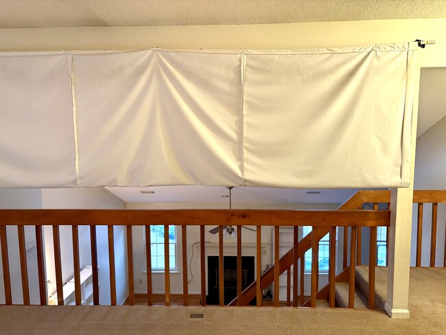 Dividing room curtain can be lowered for privacy to create a 3rd bedroom or projector screen - 208 Quarter Trl