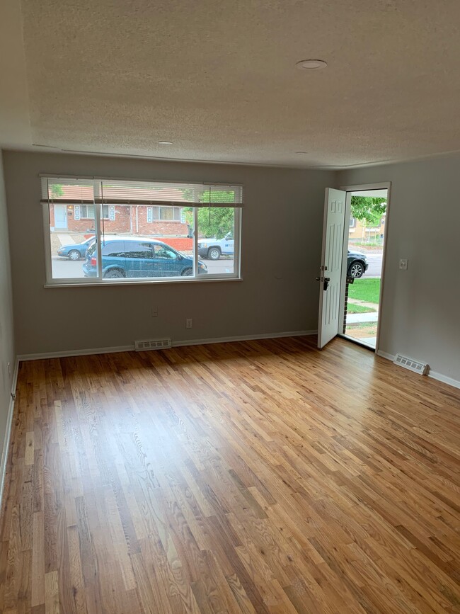 Large Living Room with hardwoods - 13613 E Nevada Pl