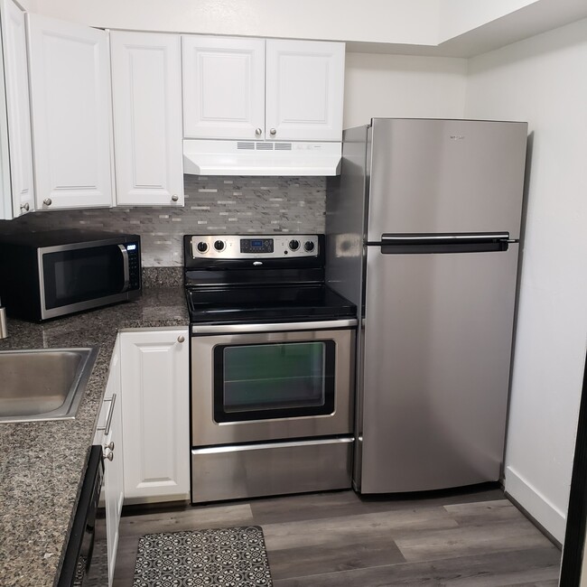 New stainless steel refrigerator and appliances with sleek modern design. - 923 Vance Jackson Rd