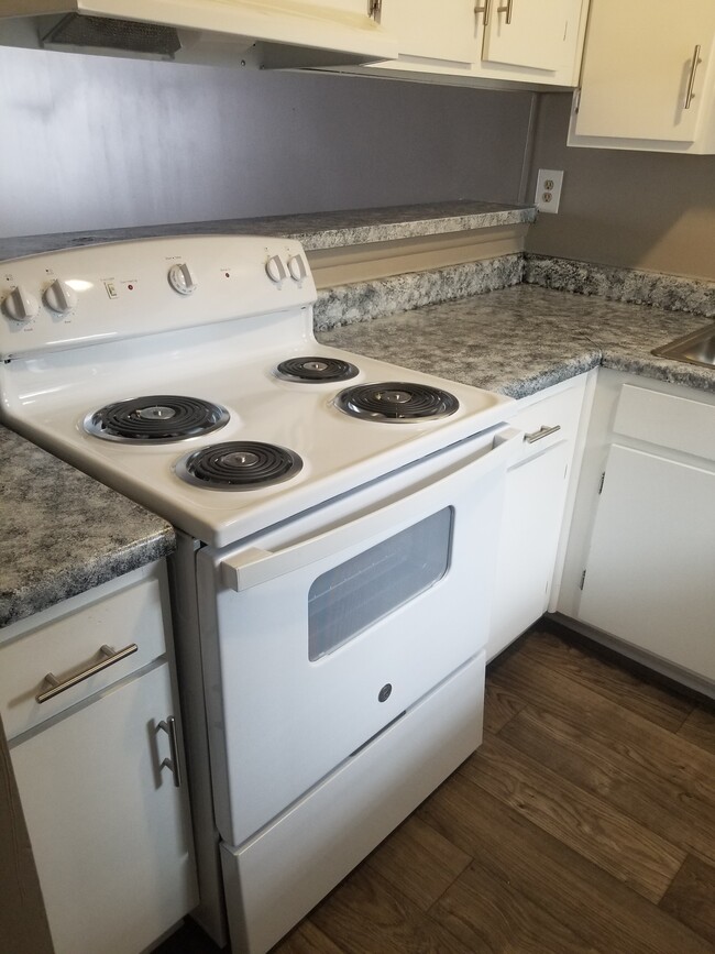 Kitchen Phase 1 showing new countertops - Magnolia Apartments