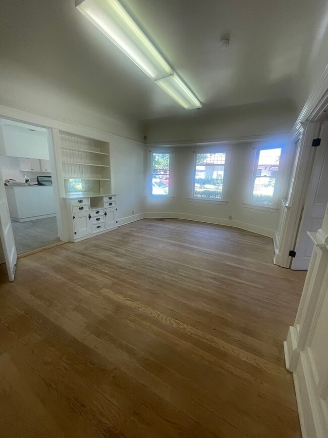 Large dedicated dining room with built-in cabinets and leaded windows. Restored hardwood floors bef - 1135 Magnolia St