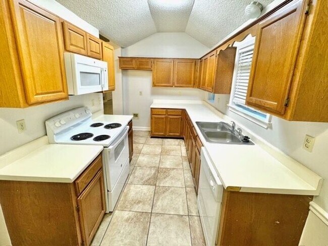 Building Photo - Now Leasing A 3 Bedroom 2 Bath Home In Bar...