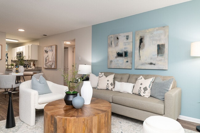 Spacious living room with hardwood-style flooring & ceiling fan - Vetra West Hills
