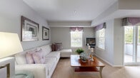 Located at 9713 Queen Anne's Lace in Laurel, MD, this single-floor, 3-bedroom, 2-bathroom home offers a well-designed layout that maximizes comfort and functionality. The entrance opens into a bright, carpeted living and dining area that flows seamlessly together. The living room features multiple windows dressed with decorative valances, filling the space with natural light, while a sliding glass door in the dining area provides access to an outdoor area. A tray ceiling detail adds architectural interest to the combined living and dining space.

The kitchen is outfitted with warm oak cabinetry, dark countertops, tile flooring, and white appliances including a range, dishwasher, refrigerator, and microwave. A pass-through window connects the kitchen to the main living area, and a pantry provides additional storage. The adjacent dining space accommodates a full dining set with ease.

The generously sized primary bedroom features plush carpeting, a large window with outdoor views, and ample room for a full furniture arrangement. Two additional bedrooms offer comfortable accommodations, each with carpeted floors and closet storage. The two bathrooms are clean and functional, one featuring mosaic tile flooring and a tub-shower combination. A dedicated laundry room and utility room round out this practical and inviting home.