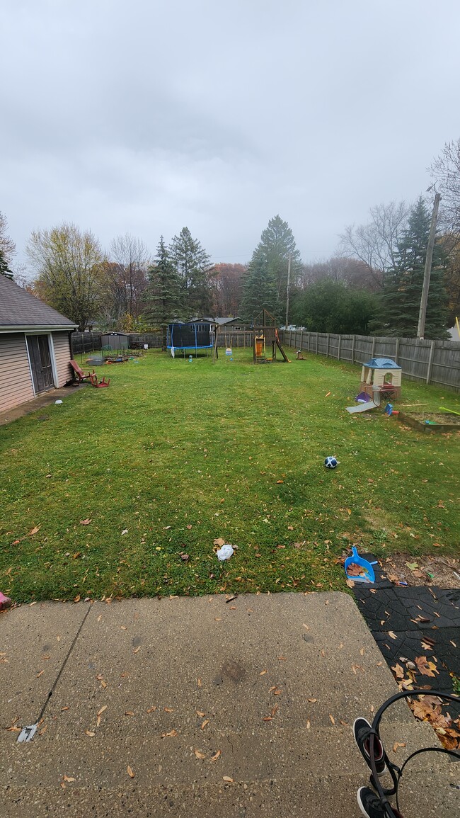 Large fenced backyard. - 1718 S Walden Ave