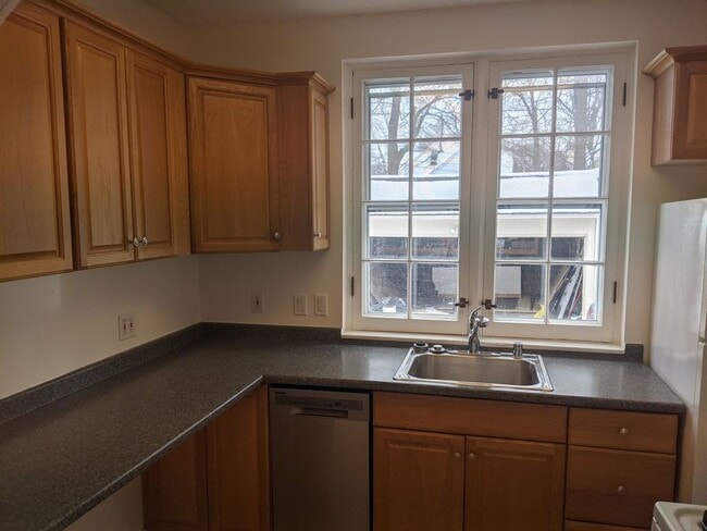 Bright kitchen with new dishwasher and oven with laminate wood floors - 4346 N Ardmore Ave