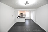 Open concept living room and kitchen - 425 E Gates St