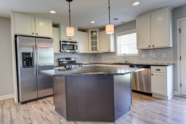 Building Photo - FANTASTIC END UNIT- NEW CARPET AND FRESH P...