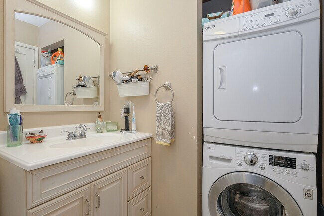 Bathroom with washer and dryer. - 2038 NE Hancock St