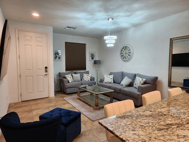 Building Photo - PARTIALLY FURNISHED SINGLE STORY TOWNHOME