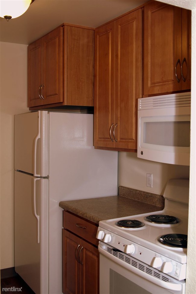 Large refrigerator. Extra tall cabinets. Microwave above range. - Cherry Hill Manor Apartments