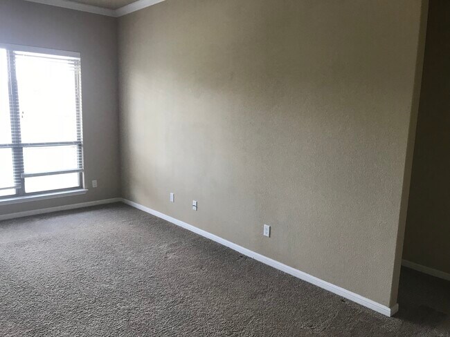 Main wall of living room. 10-foot ceilings throughout house. - 5825 Worthing