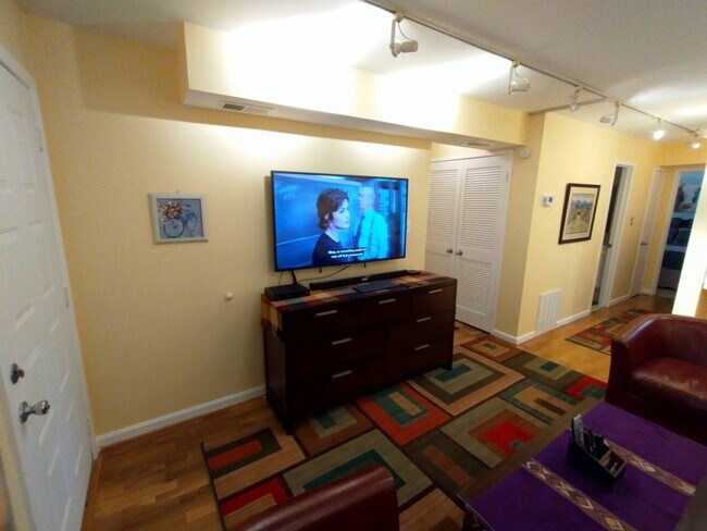 55" television with Roku, Basic Cable and Computer. 7 drawer dresser. - 1830 Bryant St NE