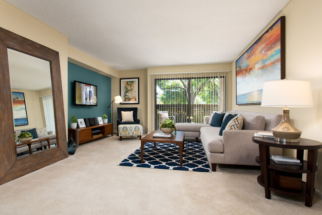 Classic living room with carpet - eaves Warner Center