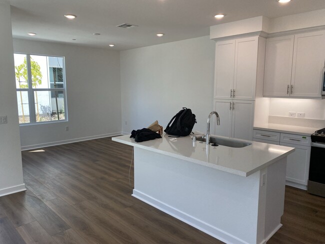 kitchen island + living room - 13086 Olympus Cir