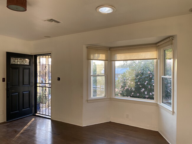 Gabled window in Living Room, front door/screen door - 2826 El Nido Dr