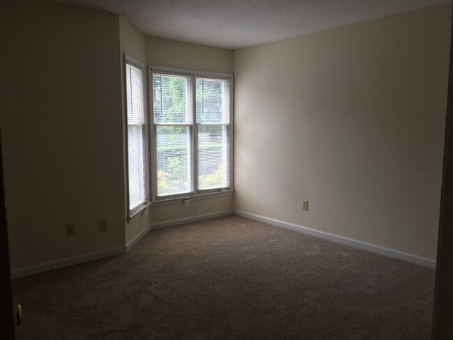 Building Photo - ONE LEVEL CONDO NEAR REX HOSPITAL -Firepla...