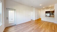 This well-appointed one-bedroom, one-bathroom residence at 99 Old Amboy Rd in Old Bridge, NJ offers a thoughtfully designed single-floor layout that maximizes comfort and functionality. Warm hardwood-style flooring flows seamlessly throughout the entire space, creating a cohesive and inviting ambiance.

The open-concept kitchen and living area serves as the heart of the home. The kitchen is outfitted with rich walnut-toned cabinetry, a classic subway tile backsplash, a sleek white peninsula countertop with an integrated sink, and a full suite of stainless steel appliances including a gas range, over-the-range microwave, and a French door refrigerator with ice maker. A built-in wine rack adds a distinctive design touch. Recessed lighting illuminates the space, while the open layout flows effortlessly into the living area.

The living room features large windows that invite generous natural light and offer views of the surrounding greenery. The spacious primary bedroom also benefits from bright window exposure and direct access to a dedicated walk-in closet, complete with built-in shelving and dual hanging rods for ample storage.

The bathroom is finished with neutral tile flooring, warm wood-toned cabinetry, a lighted vanity mirror, and a tall storage tower, providing both style and practicality.