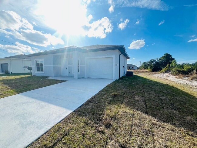 Photo - Brand-New Modern 2BR/2BA Home with Garage on Oversized Lot – Prime SW Lehigh Acres Location