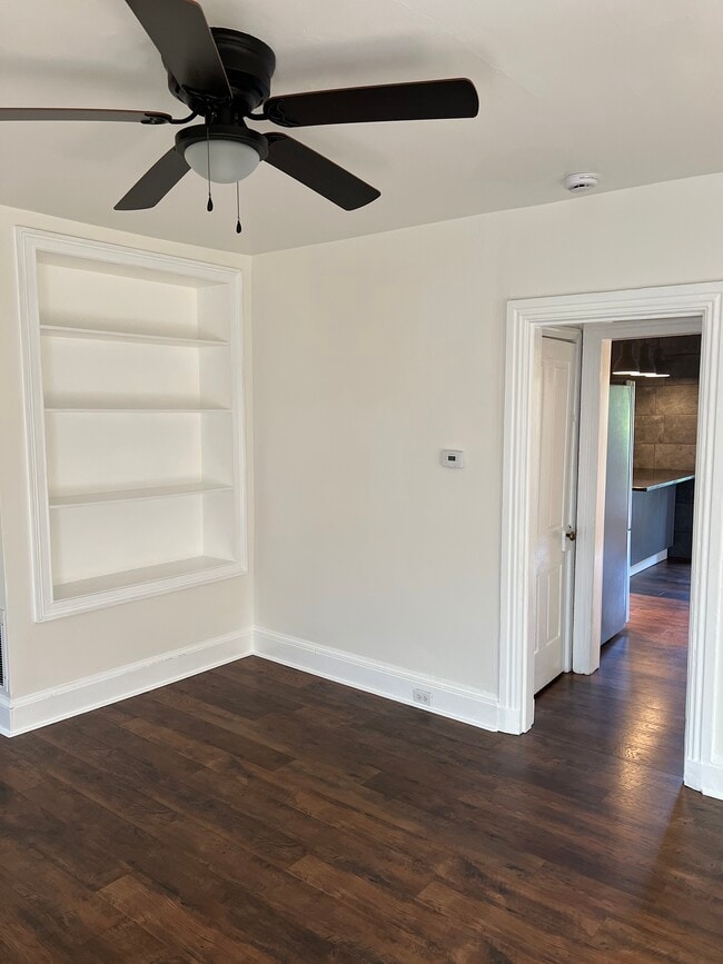 From the living room, a short hallway leads to the kitchen with doors to the basement and pantry. - 126 Merion Ave