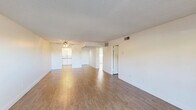 Located at 4830 Palm Avenue in Riverside, CA, this single-floor 2-bedroom, 2-bathroom home offers a well-organized layout with consistent wood-look flooring throughout. The open combined living and dining area is bright and spacious, featuring a ceiling fan with light fixture, a textured ceiling, and a sliding glass door that connects seamlessly to a private patio with outdoor views. Natural light flows generously through multiple windows across the unit.

The kitchen is thoughtfully updated with white shaker-style cabinetry, grey quartz-style countertops, a subway tile backsplash, a stainless steel double-basin sink with a modern pull-down faucet, and a stainless steel range and over-range microwave. A window above the sink allows natural light into the space.

Both bedrooms are well-proportioned, with the primary bedroom offering a generous footprint, large windows with horizontal blinds, and ample natural light. The unit includes four closets distributed throughout, providing excellent storage.

The two bathrooms each feature warm wood-toned vanities with granite-style countertops and undermount sinks. One bathroom includes a tub-shower combination with white tile surround, while the other offers a tiled walk-in shower with sliding glass doors. The hallway connects the private and shared areas of the home efficiently.