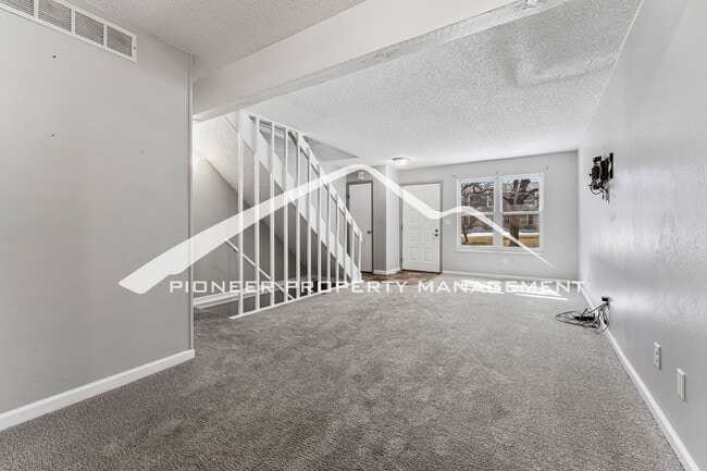 Building Photo - Updated Condo With 2 Covered Parking Spots...