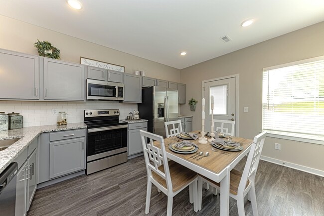 Kitchen with granite counters and stainless appliances - Sango Ridge