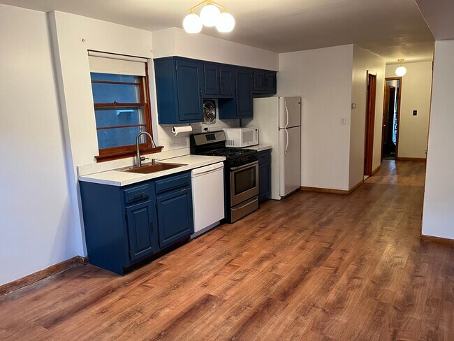 Kitchen: east-facing window, bathroom down the hall - 135 Collard St